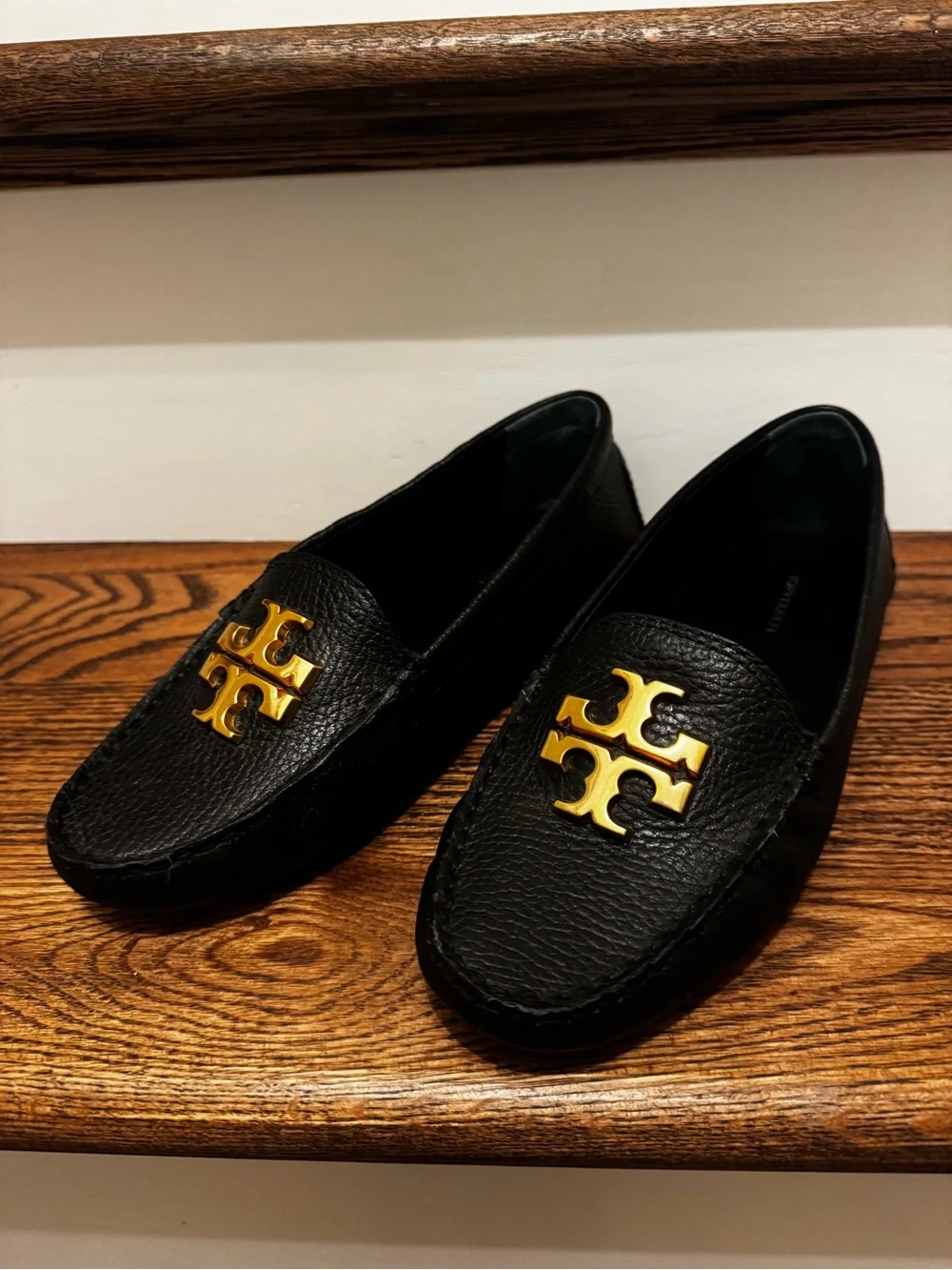 Like New Tory Burch Black Leather Loafers with Gold Logo Plaques